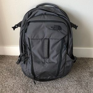 The North Face “Surge” Backpack in Grey